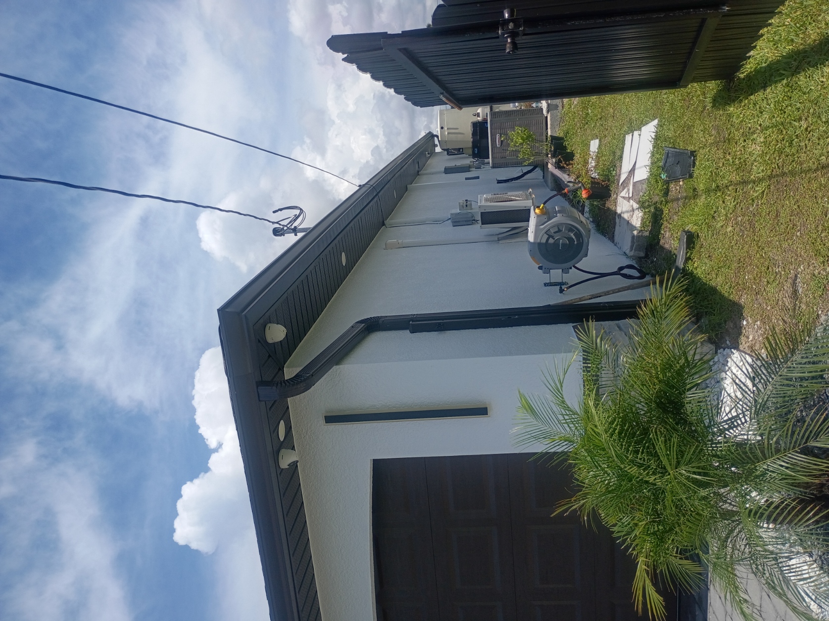 Close view of painted soffit, fascia and gutter along garage side