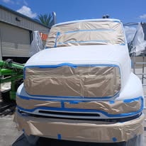 Vehicle carefully masked and prepped for painting