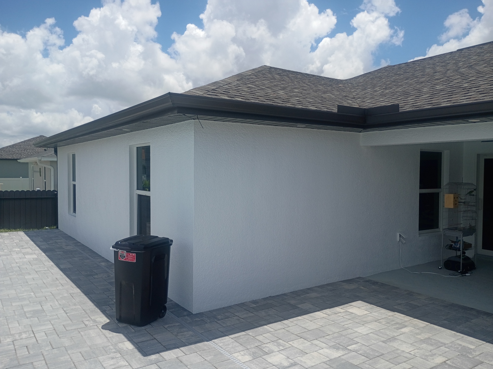 Rear exterior wall of home with smooth new paint finish