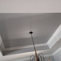 Painted gray tray ceiling with crisp white crown molding